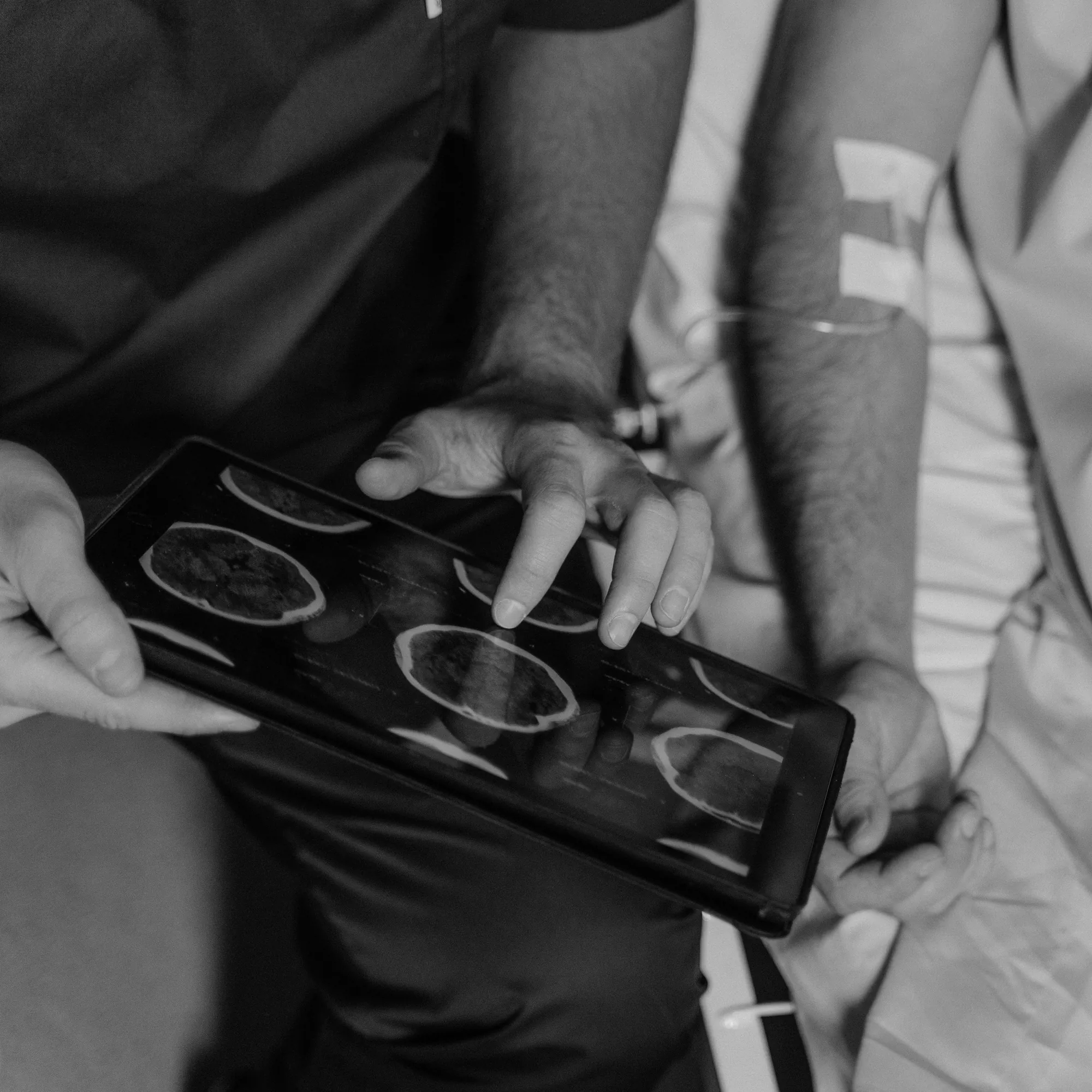 A specialist reviewing detailed scan imagery with a patient, reflecting our integrated model of care