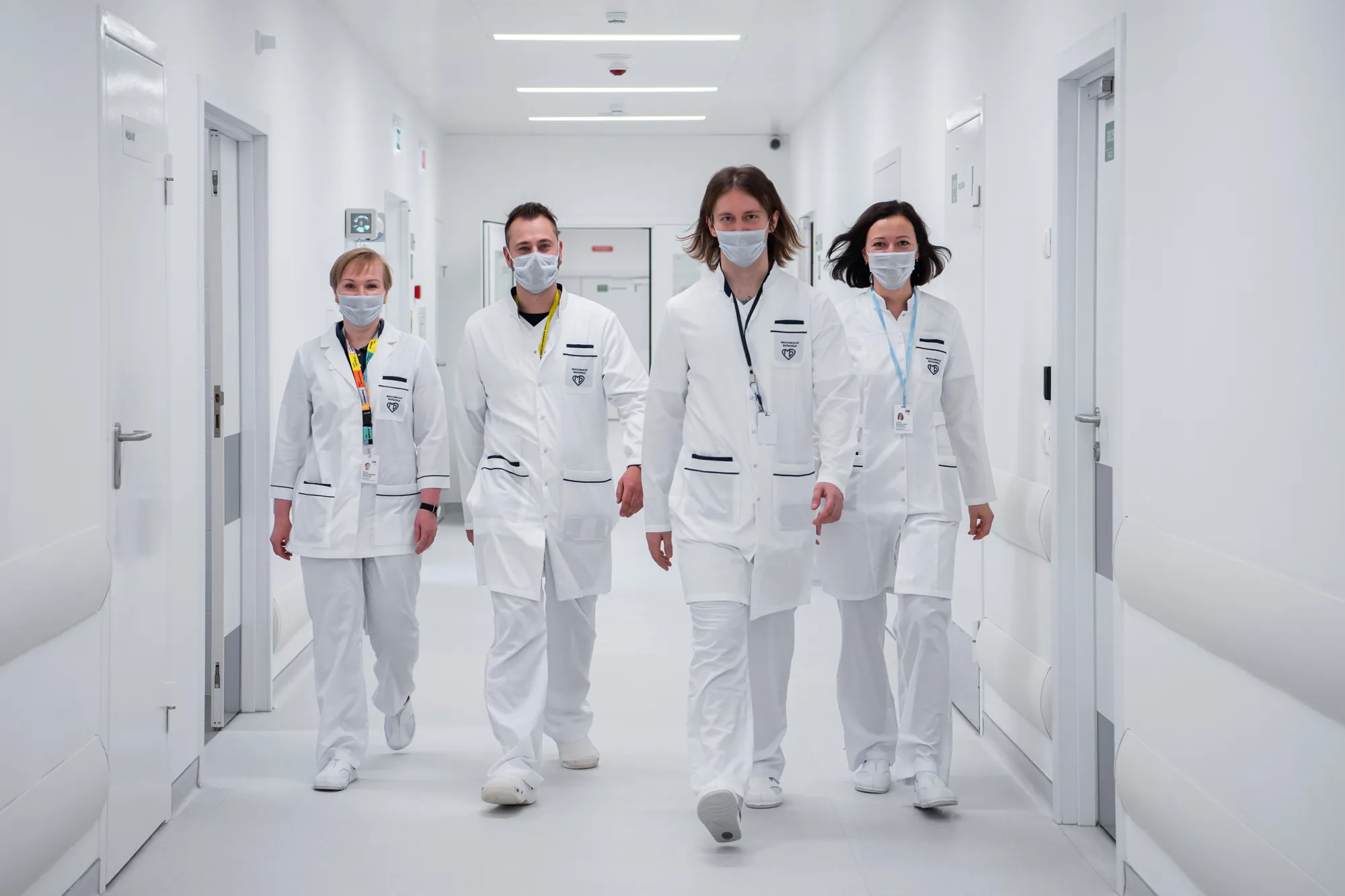 Clinical team walking through an Unfold Longevity treatment corridor